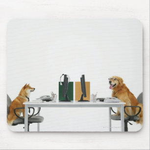Two dogs wearing tie and glasses ,sitting on mouse pad