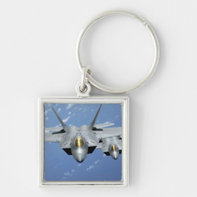 Two F-22 Raptors fly over the Pacific Ocean 2 Key Ring (Front)