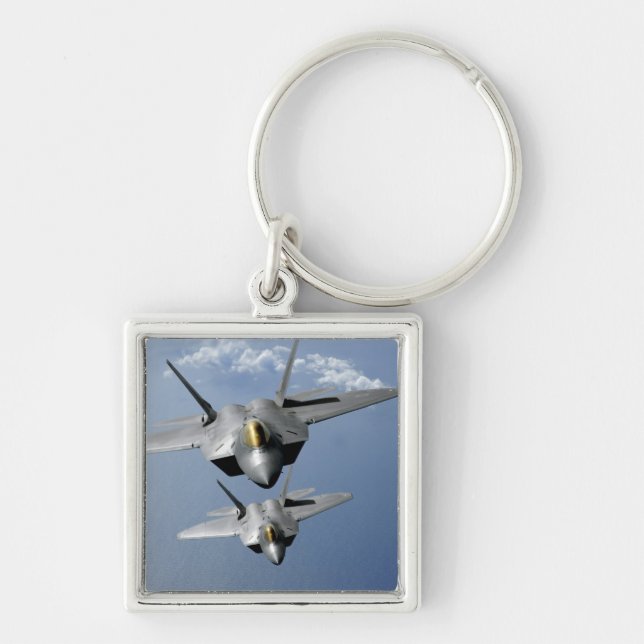 Two F-22 Raptors fly over the Pacific Ocean Key Ring (Front)