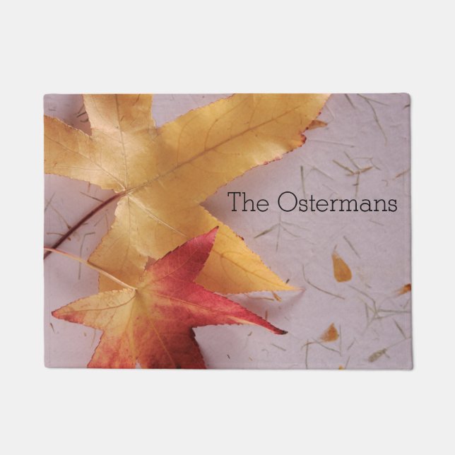 Two fall leaves on texture doormat (Front)