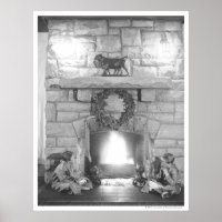 Two girls sitting by a fireplace at Christmas