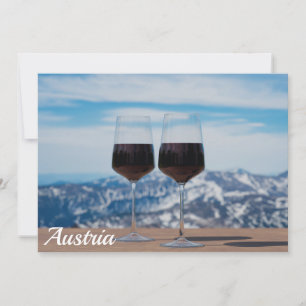 Two glasses of red wine against mountains
