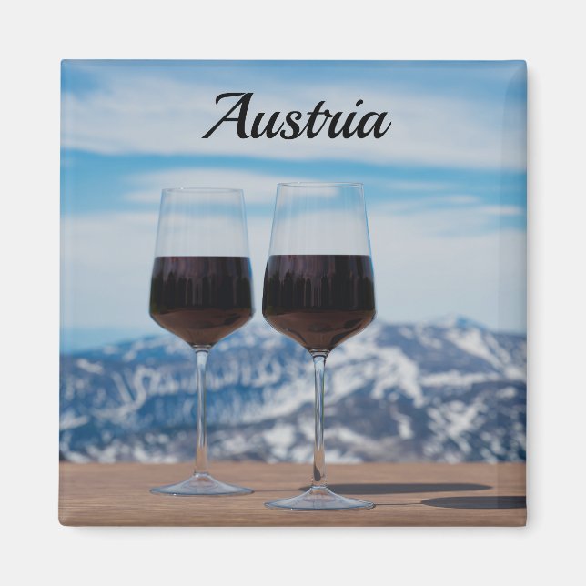 Two glasses of red wine against mountains magnet (Front)