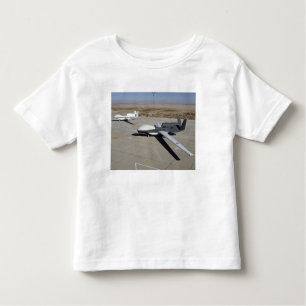 Two Global Hawks parked on a ramp Toddler T-Shirt