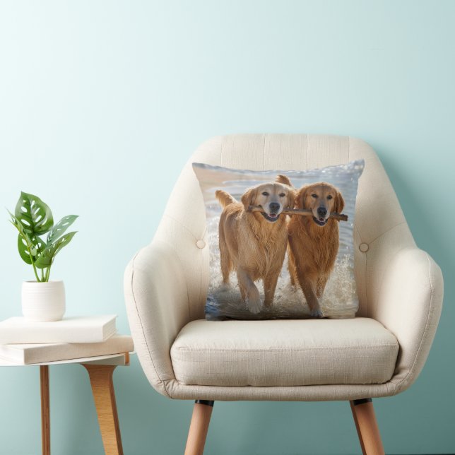 Two Golden Retrievers Carrying a Stick Cushion (Chair)