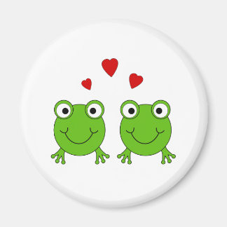Two green frogs with red hearts. magnet