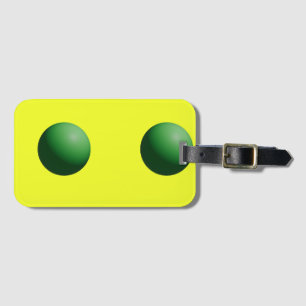 Two Green Spheres on Yellow Luggage Tag