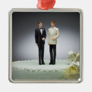 Two groom figurines on top of wedding cake metal tree decoration