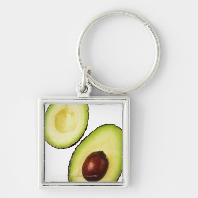 Two halves of an an avocado, on white key ring (Front)