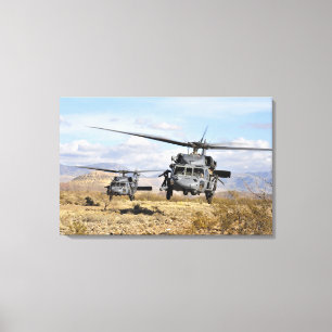 Two HH-60 Pavehawk helicopters preparing to lan Canvas Print