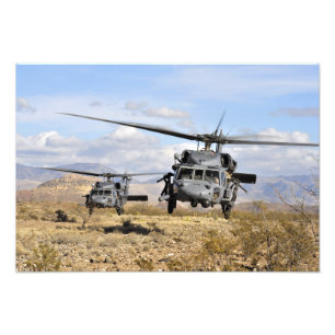 Two HH-60 Pavehawk helicopters preparing to lan Photo Print