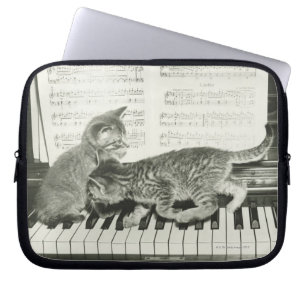 Two kitten playing on piano keyboard, (B&W) Laptop Sleeve