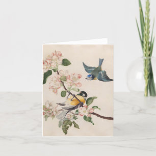 Two little birds near a branch of apple blossoms, holiday card