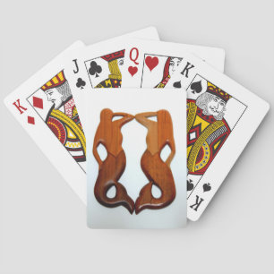 two mermaids playing cards