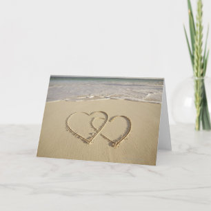 Two overlying hearts drawn on the beach card