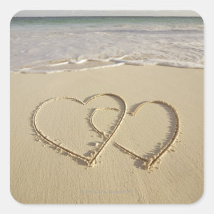 Two overlying hearts drawn on the beach square sticker