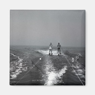 Two people waterskiing magnet