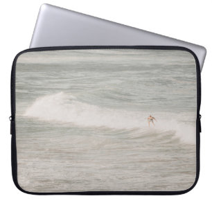 TWO PERSON SURFING ON SEA WAVES DURING DAYTIME LAPTOP SLEEVE