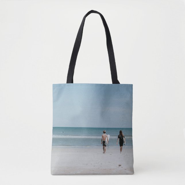 Two person walking on coast tote bag (Front)