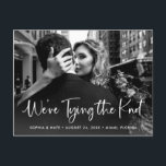 Two Photo | White Script Tying the Knot Announcement Postcard<br><div class="desc">This whimsical and modern wedding save the date postcard features two of your favourite personal photos, with trendy white rustic handwritten script that says "we're tying the knot." The back contains a second photo with a translucent overlay, and more of your wedding details and information. A simple and casual look...</div>