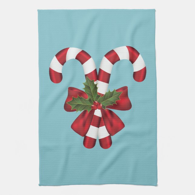Two Red And White Festive Candy Canes On Blue Tea Towel (Vertical)
