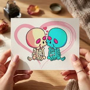 Two romantic skeletons kiss with pink heart postcard