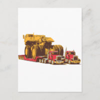 Two Semi Big Trucks carrying a Huge Mining Truck