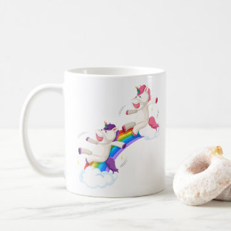 Two unicorns sliding down rainbow coffee mug