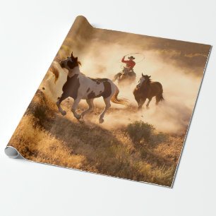 Two western cowboys riding horses, roping wild hor wrapping paper