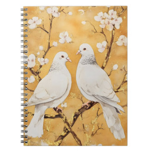  two white doves perched on a branch notebook