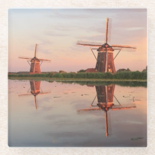 Two windmills with reflection at sunset glass coaster