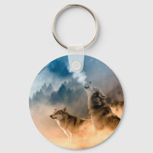 Two wolves howl at the full moon in forest key ring