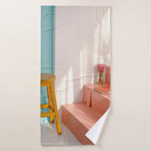 Two yellow wooden bar stools bath towel