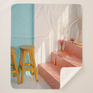 Two yellow wooden bar stools sherpa blanket