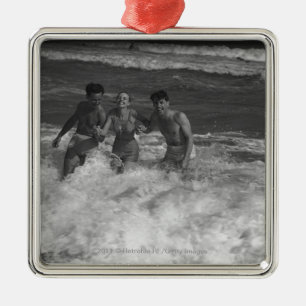 Two young men and woman playing in wave B&W Metal Tree Decoration