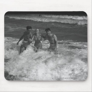 Two young men and woman playing in wave B&W Mouse Pad