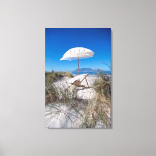 Umbrella And Chair On Beach Canvas Print