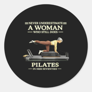 Underestimate a woman who does pilates in 70s classic round sticker