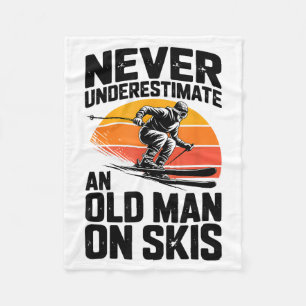 Underestimate an old man on skis funny skiing fleece blanket