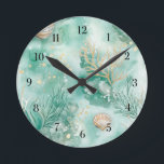 Underwater Coral & Shells in Teal Watercolor Round Clock<br><div class="desc">Transform your space into a serene seaside escape with this stunning round clock featuring an underwater coral and shell design. Painted in calming teal tones with watercolor textures, the design captures the quiet magic of the ocean floor. Soft coral branches and delicate seashells seem to float across the clock face,...</div>