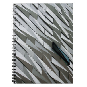 Undulating abstract shapes on a building facade at notebook