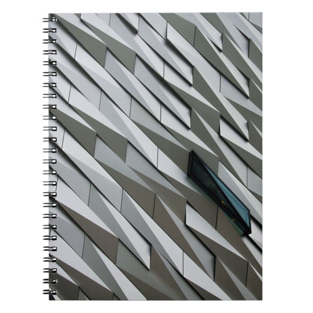Undulating abstract shapes on a building facade at notebook (Front)
