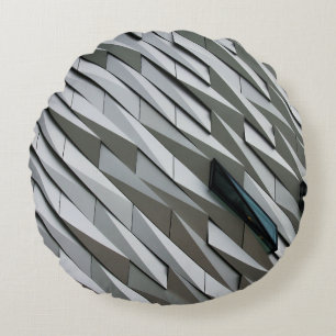 Undulating abstract shapes on a building facade at round cushion