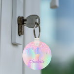 Unicorn glitter rainbow monogram name holographic key ring<br><div class="desc">A trendy holographic background with unicorn and rainbow pastel colours in pink,  purple,  rose gold,  mint green. Decorated with faux glitter drips in rose gold,  pink and purple. Personalise and add your name.  Purple coloured letters.  A bit of everyday glam to brighten up your day!</div>
