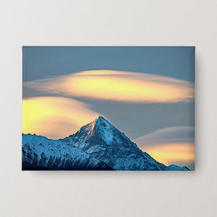 Unique Clouds Over Snow Covered Mountains