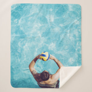 Unknown person playing beach volleyball sherpa blanket
