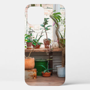 Urban jungle. Winter garden with plants, flowers.  iPhone 12 Case
