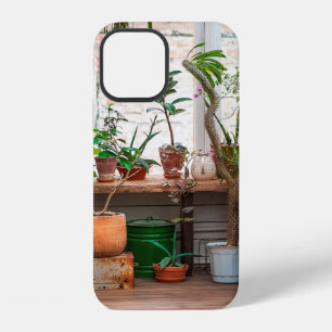 Urban jungle. Winter garden with plants, flowers.  iPhone 12 Case