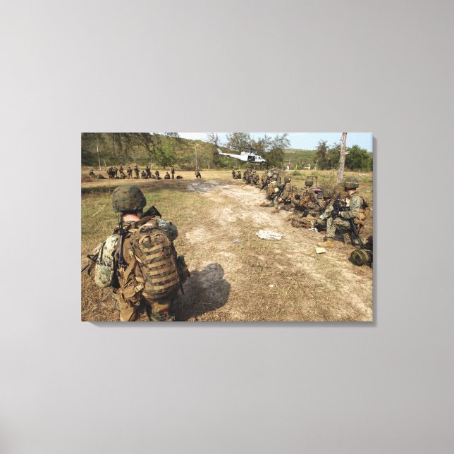 US Marines provide security as a UH-1N Canvas Print (Front)