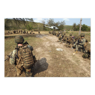 US Marines provide security as a UH-1N Photo Print